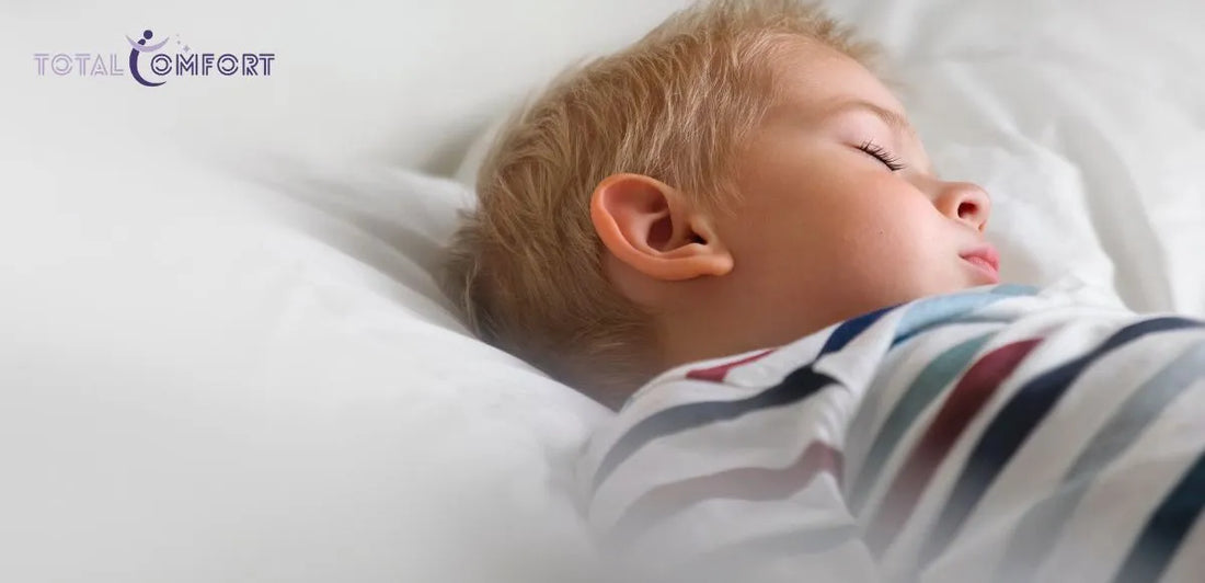 Young child sleeping peacefully on a supportive and breathable mattress designed for growing children.