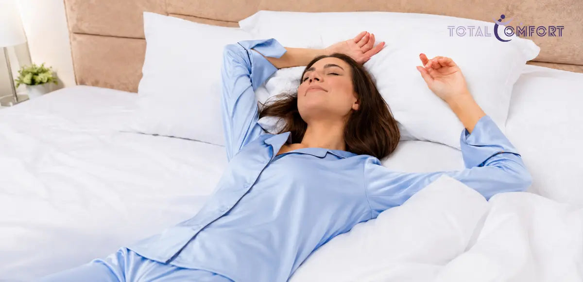 Person lying on their back on a mattress, illustrating a comfortable back-sleeping position.