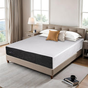 Bedroom with a bed featuring a mattress and pillows, surrounded by windows and furniture.